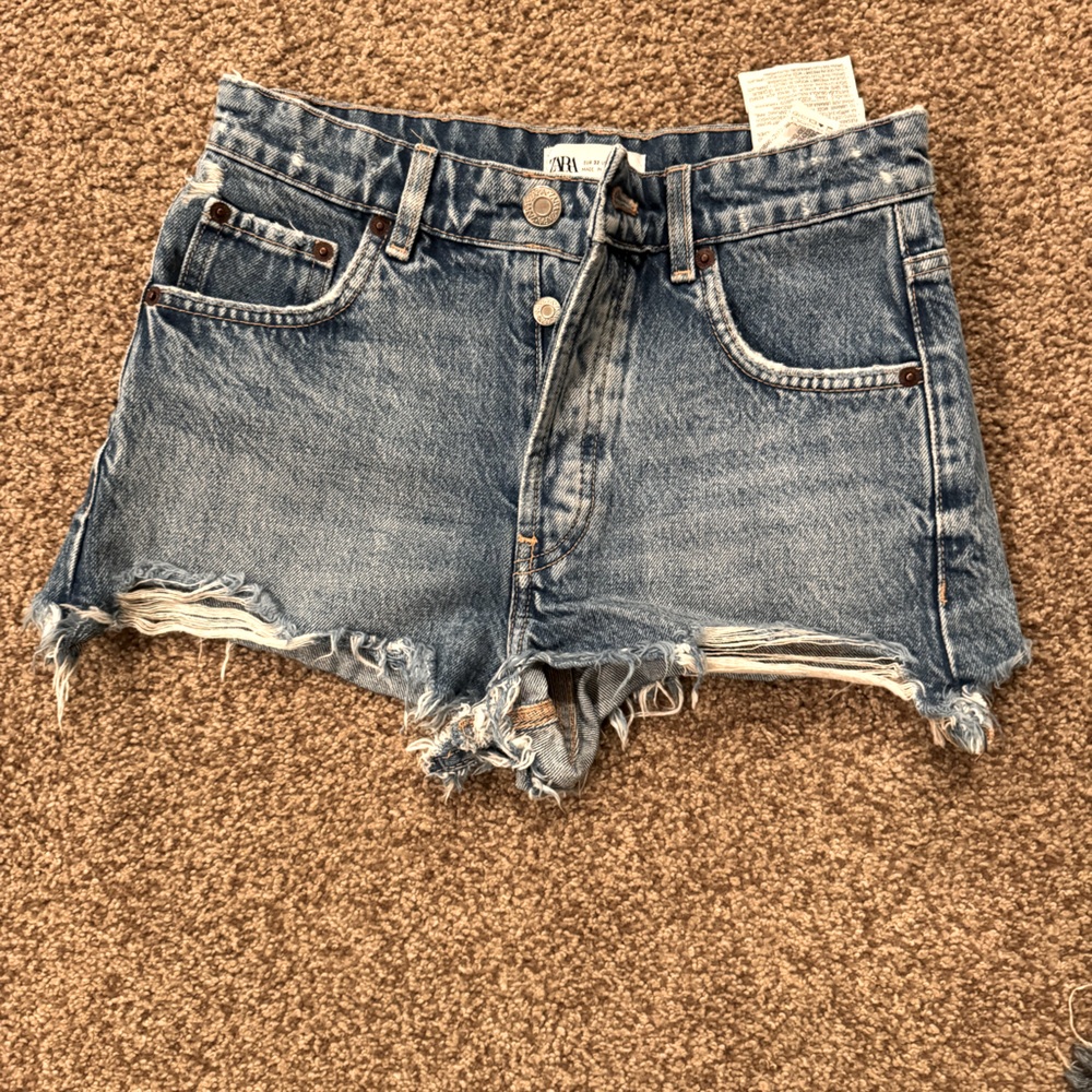 Zara size 0 jean shorts button fly medium wash distressed.